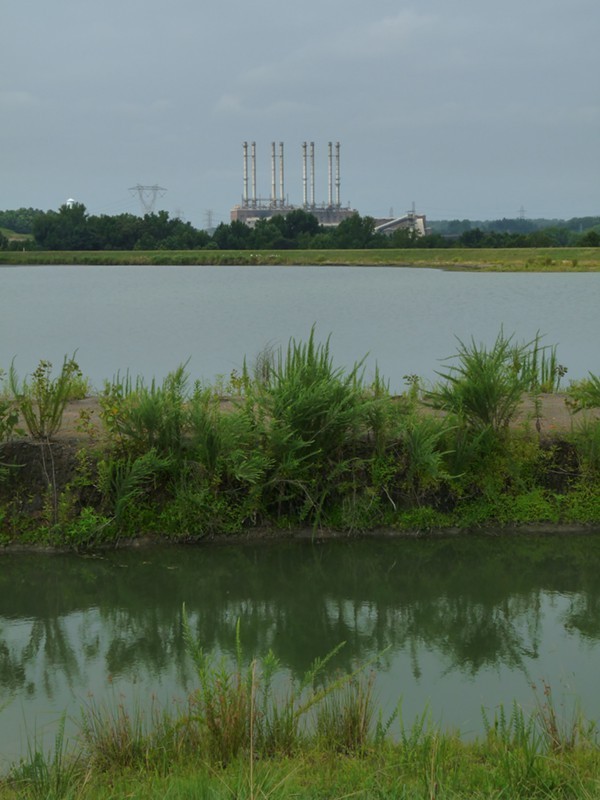 Looking across one of the two unlined, high-hazard coal ash ponds at Duke Energys Riverbend coal plant. The pond was built in 1957, covers over 40 surface acres and is 80-feet deep.