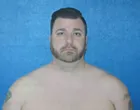 Former 92.3 The Fan Producer J.G. Spooner, Charged With Money Laundering, Takes Shirtless Mugshot Photo