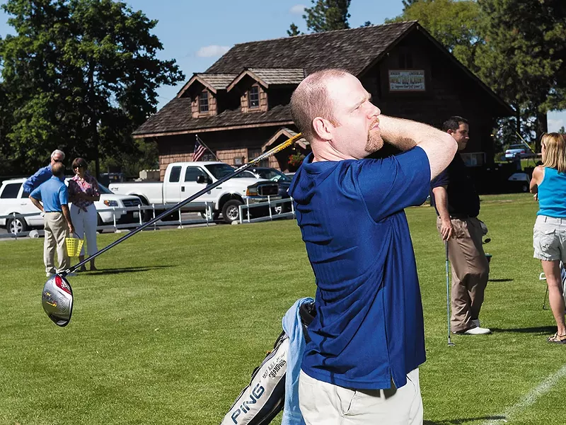 Clint Preston practicing on the driving range at Indian Canyon Golf Course. - STEPHEN SCHLANGE