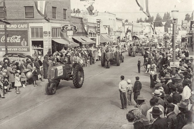 Tractors roll through downtown Redmond during the 1947 fair parade. - COURTESY ROSS ROGERS AND THE DESCHUTES COUNTY FAIR &amp; RODEO
