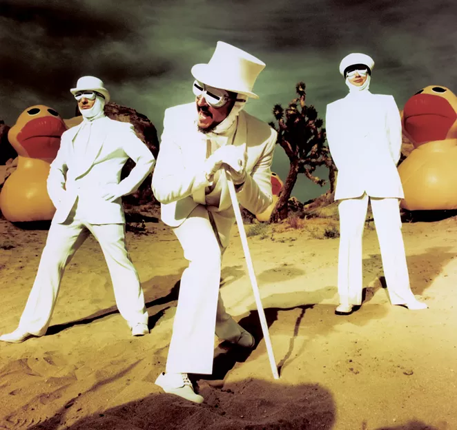 The members of Primus, in white-suit glory. - CHAPMAN BAEHLER