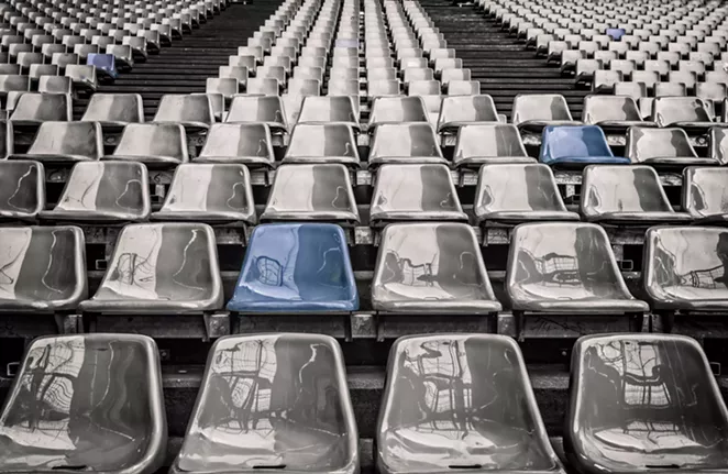 An empty stadium - an ominous representation of what might be to come (and what is already happening). - PIXABAY