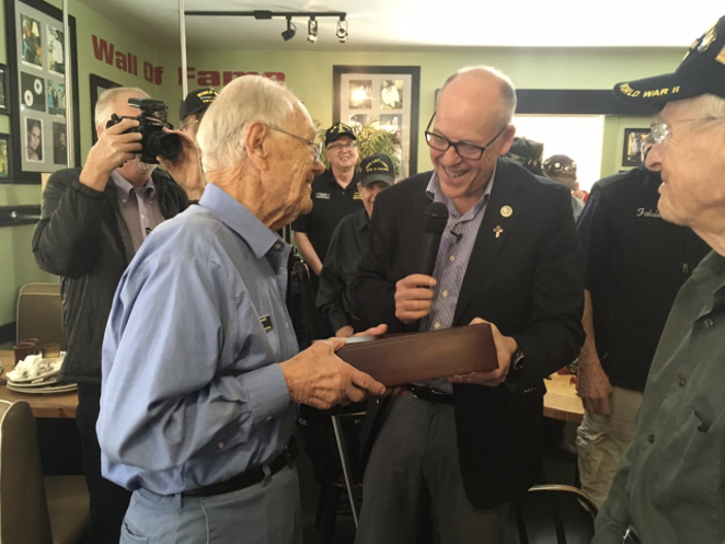 Greg Walden presents Bob Maxwell with American flag flown over U.S. Capitol to honor Maxwell’s 97th birthday in 2017 in Bend. - COURTESY REP. GREG WALDEN