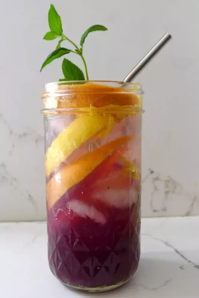 Lemon, grapefruit juice, spearmint and rose petals combine with grape juice to make this thirst-quenching summer drink. - ARI LEVAUX