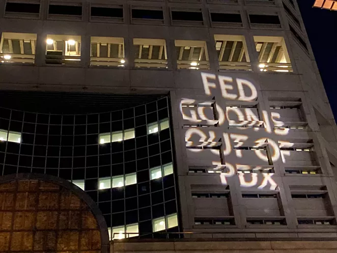 A projection on the exterior of the Multnomah County Justice Center July 22. - NICOLE VULCAN
