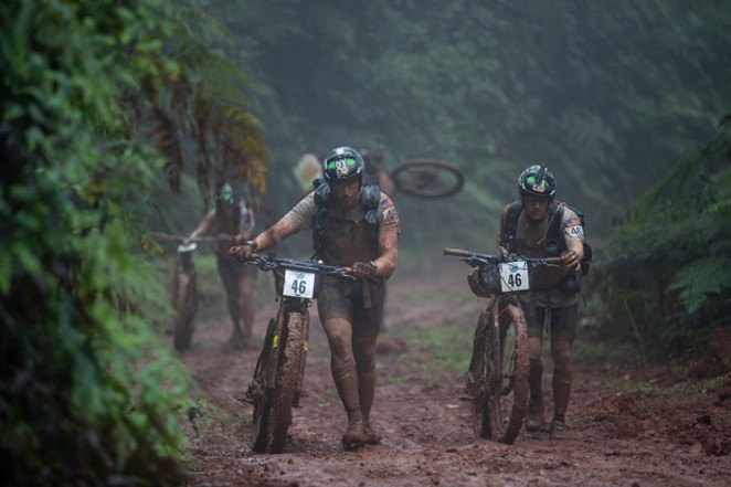 Team Bend tackles a mountain biking portion of the Eco-Challenge, and the road at this point in the &#10;competition was physically unrideable. - COURTESY AMAZON STUDIOS