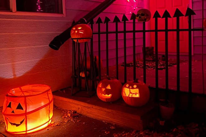 Headstones crafted from cardboard invite the neighborhood kids to go through on Halloween night&mdash;if they dare. - MIKE MANSER