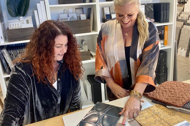 Co-owners and founders Kerri Rossi and Jane Wirth pick out the latest in design trends from their new Element Design Collective showroom; laying out surface textures in the Elemental Design Collective showroom helps clients visualize their remodels and new builds. - COURTESY KERRI ROSSI