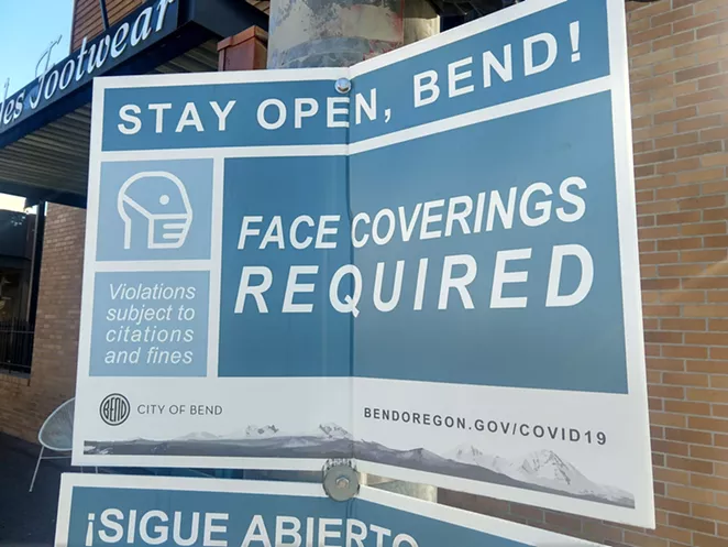 Caption: “Stay Open Bend!” sign on the corner of NW Franklin Ave. and NW Wall St. in downtown Bend. - ASHLEY MORENO