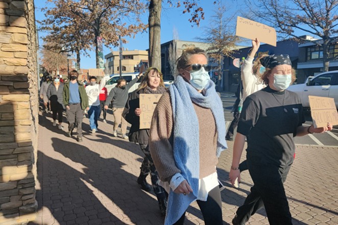Protesters march from the Deschutes County Courthouse to the makeshift Barry Washington memorial in Downtown Bend. - JACK HARVEL