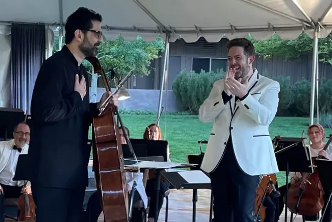Maestro Mitchell applauds cellist Amit Peled after his solo performance in Sunriver last summer. - SUBMITTED