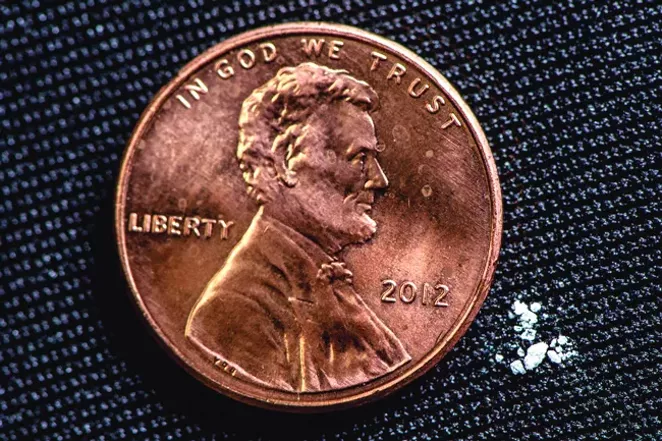 The couple of miligrams of fentanyl shown next to this penny could be fatal. - COURTESY OF THE NATIONAL DEFENSE UNIVERSITY