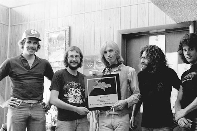Back in the day, author Dan Mooney, left, poses with KATT-FM Program Director Mike Bailey, the man himself &mdash; Tom Petty &mdash; and two unidentified men. - COURTESY DAN MOONEY