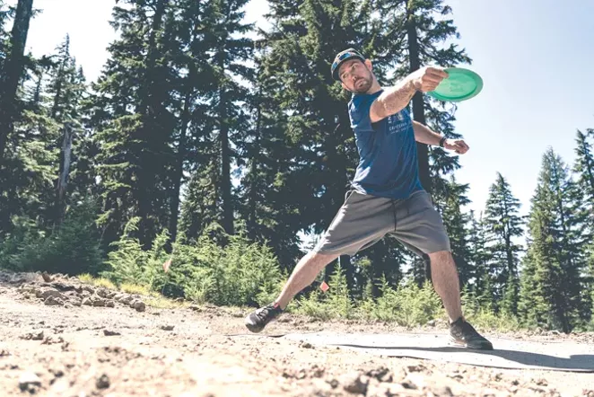 A disc golfer tees off at the Skyline Park course. - MIKE BESHORE