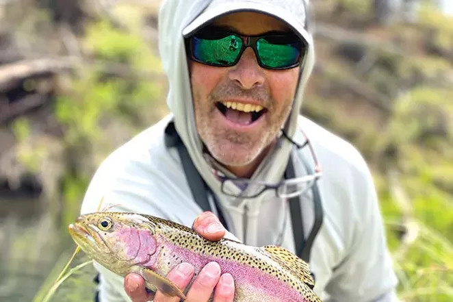 The author with a Fall River Redside caught with a homemade fly. - THOMAS SEYMOUR