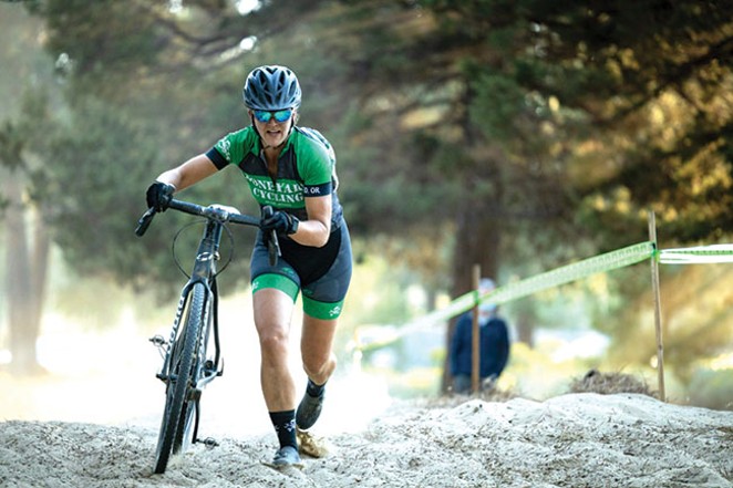 In this cyclocross race, the rider pushes the bike through a grueling portion. - COURTESY MBSEF