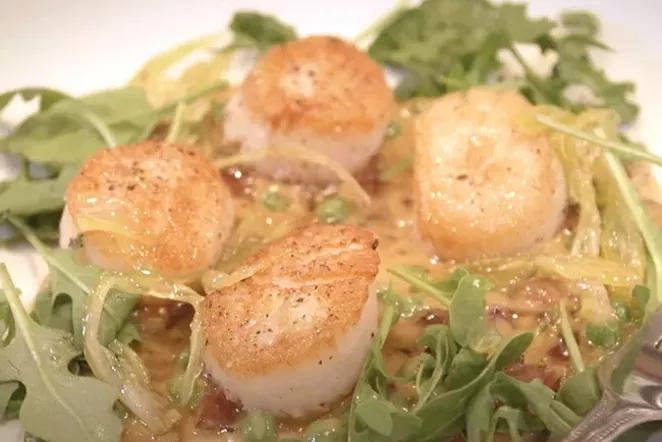 Seared scallops with bourbon bacon sauce and pickled celery caramel. - COURTESY DONNA BRITT