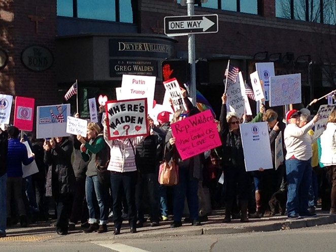 Protesters in Bend call on Walden to face constituents.