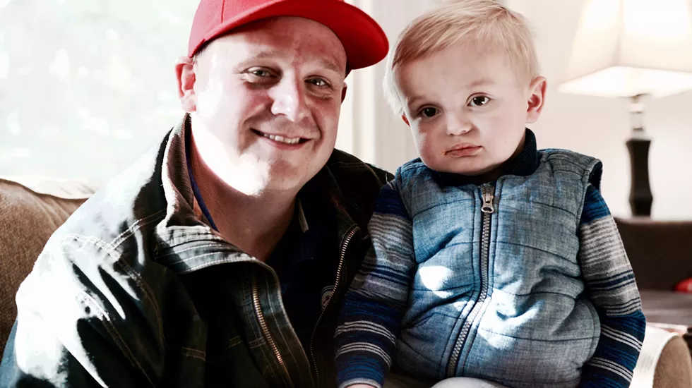 "The guys are like his uncles. He loves to play with them, and they love to play with him too." Chip, with his son, Beau. - MAGDALENA BOKOWA