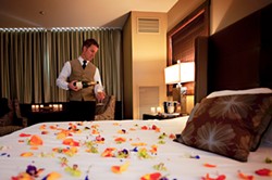 Chilled champagne and a bed of flowers await downtown dandies. - BYRON ROE C/O OXFORD HOTEL