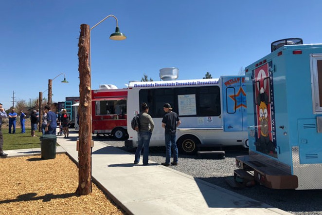 Customers wait for their order at the food truck at On Tap, Bend's newest hangout for food and beer on the East Side. - LISA SIPE