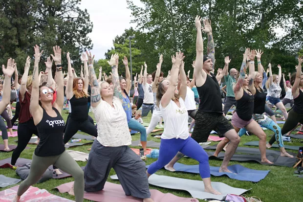 Yogis get their Warrior One on during the pre-show yoga sesh at the Art Station Tuesday. - ANNE PICK