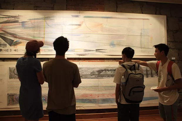 Jamaica Sweet, Ryan Martin, Andrew Leung and Clark Miyamoto observing Bill Hoppe's art from the 1970s. - DANIELLE MEYERS
