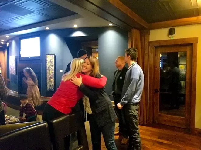 Cheri Helt hugs a supporter during her election night party Tuesday night. - AMANDA KLINGMAN