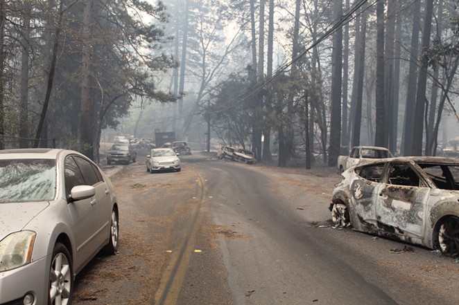 Drivers abandoned their cars to get away from the fire in Paradise, Calif. - MEREDITH J. COOPER, CHICO NEWS & REVIEW
