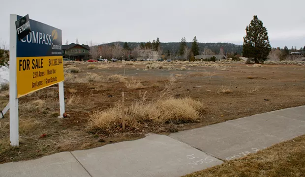 The bare land by The Pavilion where 170 apartments could be going up if a LUBA appeal is denied. - CHRIS MILLER