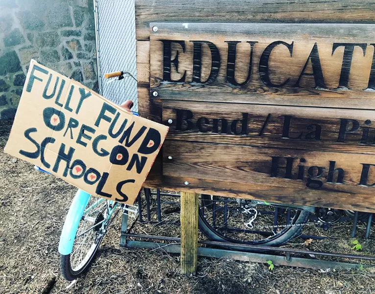 Signs from the May 8 March for Students in downtown Bend. - NICOLE VULCAN