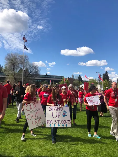 People rally for school funding on May 8 during the March for Students in downtown Bend. - NICOLE VULCAN