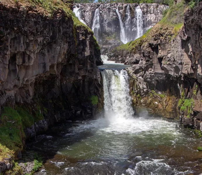 White River Falls towers 90 feet above a historic power plant at White River Falls State Park. - KEELY DAMARA