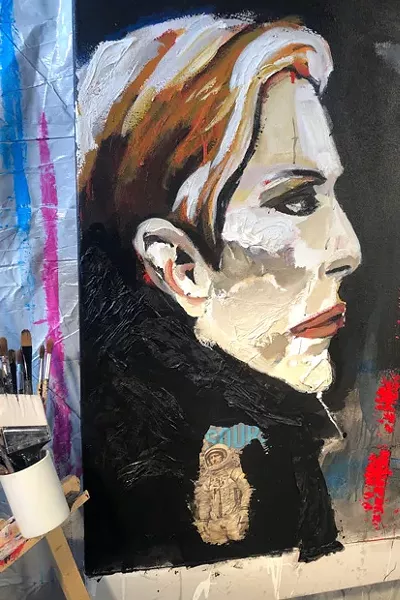 This shows a detailed section of the David Bowie painting that also incorporates a recent Source Weekly cover. Bowie is thought to have died by assisted suicide. - NICOLA CARPINELL