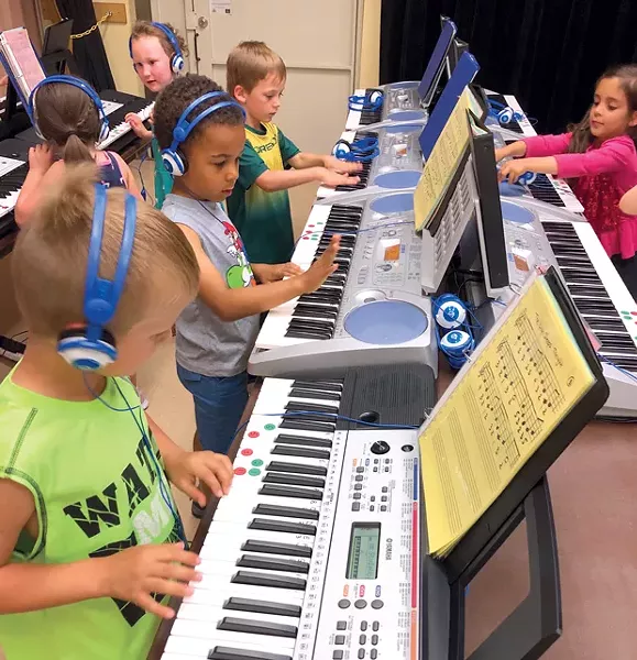 Students at Ponderosa Elementary learn the ropes of the keyboard thanks to a grant from the Education Foundation. - SUBMITTED