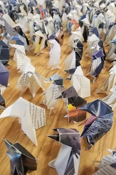 “Flock,” an origami installation by Susan Porteous, was one of the exhibits during the Bend Art Center's closing reception in August 2019. - CHRISTIAN BROWN