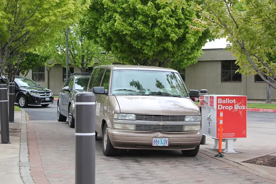 Last minute ballot drop-offs at the Deschutes County Services Building at 6pm Tuesday night. - LAUREL BRAUNS
