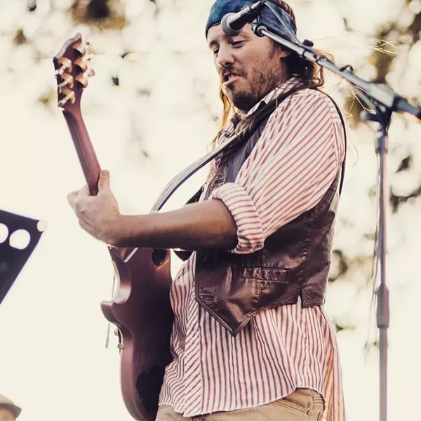 When he's not \donating food to St. Charles, Leadbetter can typically be found rocking out on stage. - COURTESY OF ERIC LEADBETTER