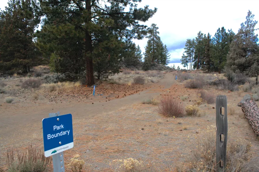 A park boundary sign is staked on the site of the new 37-acre Alpenglow Park off 15th Street in Southeast Bend. There is an upcoming public open house about the park at the Bend Senior Center on Thursday, Feb. 22, from 6 to 8 pm. - SOURCE STAFF