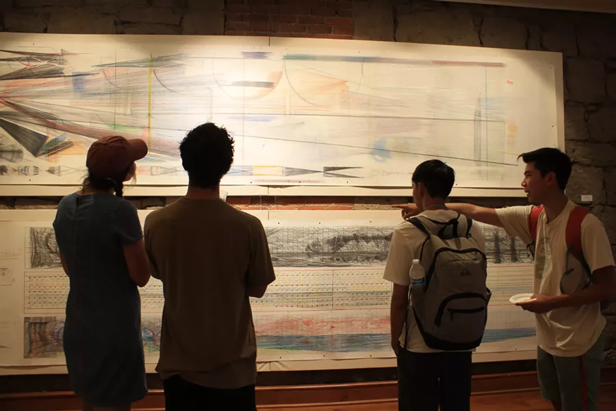 Jamaica Sweet, Ryan Martin, Andrew Leung and Clark Miyamoto observing Bill Hoppe's art from the 1970s. - DANIELLE MEYERS