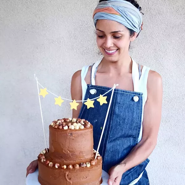Karla Diaz Cano bakes clean, healthy cakes for Rawmona's Kitchen. Rawmona started as an illustration but you can still buy her on a greeting card when you visit Rawmona's Kitchen. - LISA SIPE