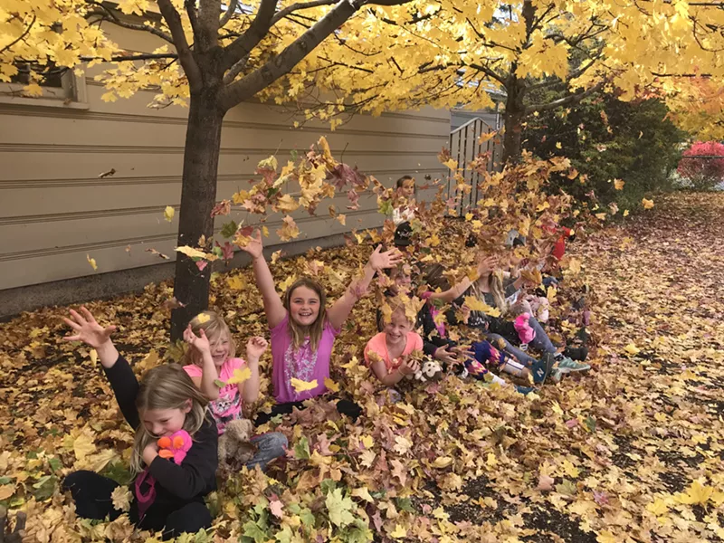 Kids at Highland Elementary play in the leaves during their time in Bend Park and Recreation District's Kids Inc. program. - BEND PARK AND RECREATION DISTRICT