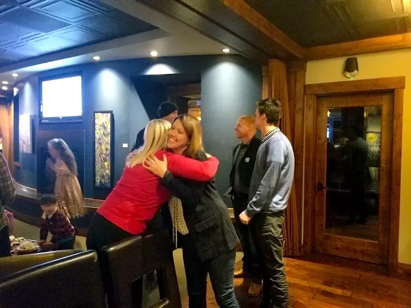 Cheri Helt hugs a supporter during her election night party Tuesday night. - AMANDA KLINGMAN