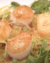 Seared scallops with bourbon bacon sauce and pickled celery caramel.