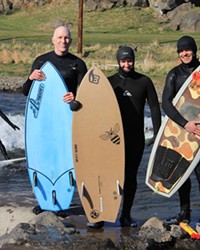 From left, Conway Bixby, Chris Caldentey and Kea Eubank hug their handcrafted river surfboards.