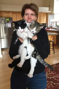 Lori Lubbesmeyer with her three adopted kitties. - SUBMITTED