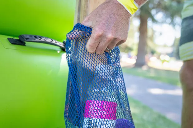 A full mesh bag trash receptacle, post-Green Tube floating. - NATE WYETH