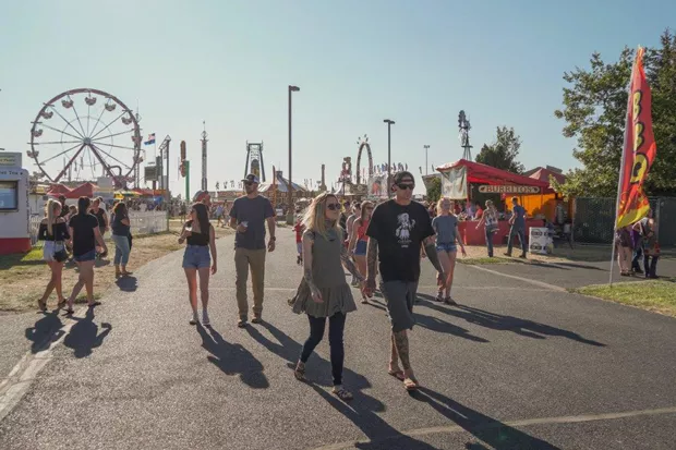 Visitors stroll along the midway at the Deschutes County Fair + Rodeo. - DESCHUTES FAIR AND EXPO CENTER