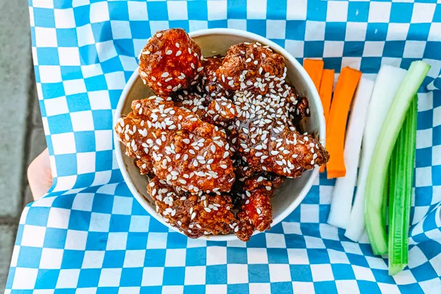 Fried chicken bites tossed in a spicy Thai sauce. - NANCY PATTERSON
