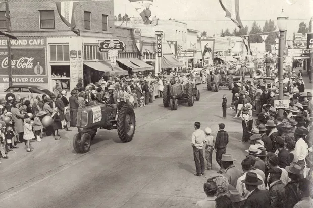 Tractors roll through downtown Redmond during the 1947 fair parade. - COURTESY ROSS ROGERS AND THE DESCHUTES COUNTY FAIR & RODEO